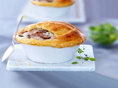 Bouchées à la reine en cassolette aux cèpes et ris de veau