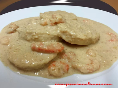Médaillons de merlu sauce oignon